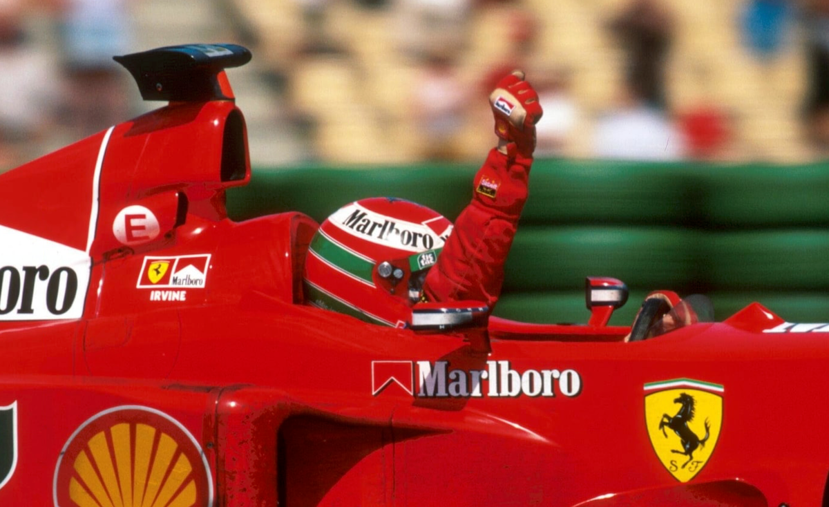 1999 Eddie Irvine Signed Race Used Scuderia Ferrari F1 Nomex